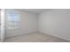 Well-lit bedroom featuring a window and closet at 70 Scenic Rock Dr, Youngsville, NC 27596