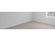 Simple bedroom with neutral carpeting and large window at 70 Scenic Rock Dr, Youngsville, NC 27596