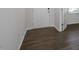 Hardwood floors in the entryway with a door leading to the main living space at 70 Scenic Rock Dr, Youngsville, NC 27596
