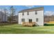 Two-story home with backyard deck and grassy area at 70 Scenic Rock Dr, Youngsville, NC 27596