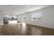 Open concept kitchen and living area with island and stainless steel appliances at 70 Scenic Rock Dr, Youngsville, NC 27596