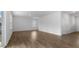 Open living area with hardwood floors and sliding glass door to patio at 70 Scenic Rock Dr, Youngsville, NC 27596