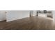 Open living room with wood-look floors and kitchen views at 70 Scenic Rock Dr, Youngsville, NC 27596