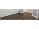 Bright spare bedroom with wood-look floors and neutral walls at 70 Scenic Rock Dr, Youngsville, NC 27596