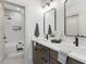 Modern bathroom with double vanities, sleek fixtures, and a shower/tub combo for a spa-like experience at 734 S State St, Raleigh, NC 27601