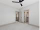 Spacious bedroom with neutral tones, including a ceiling fan, and easy access to closets and other rooms at 734 S State St, Raleigh, NC 27601