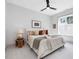 Cozy bedroom with a ceiling fan, soft carpet, neutral tones, and natural light at 734 S State St, Raleigh, NC 27601