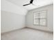 Neutral bedroom with modern ceiling fan, carpet floors and a large window at 734 S State St, Raleigh, NC 27601