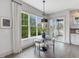 Sunlit dining area featuring large windows and access to an outdoor patio space at 734 S State St, Raleigh, NC 27601