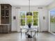 Bright dining nook with large windows offering a view of the surrounding greenery at 734 S State St, Raleigh, NC 27601