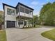 Modern two-story home with a convenient attached garage and stylish black-framed porch at 734 S State St, Raleigh, NC 27601