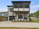 Modern two-story home with attached garage and black-framed porch at 734 S State St, Raleigh, NC 27601