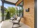 Relaxing front porch with comfortable seating area featuring rocking chairs and stylish wood accents at 734 S State St, Raleigh, NC 27601