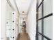 Bright hallway with wood floors leads to living spaces, showcasing elegant trim and natural light at 734 S State St, Raleigh, NC 27601