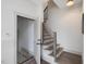 Hallway with stairs, contemporary railing, and entry to lower basement at 734 S State St, Raleigh, NC 27601