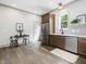 Kitchen features stainless appliances, wooden cabinets, and a cozy eat-in area with natural light at 734 S State St, Raleigh, NC 27601