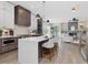 Open-concept kitchen features a large island with seating and views to Gathering room with fireplace at 734 S State St, Raleigh, NC 27601