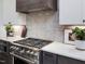 A gourmet kitchen featuring stainless steel appliances and white countertops at 734 S State St, Raleigh, NC 27601
