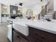 A contemporary kitchen island featuring a farmhouse sink, stainless steel appliances, and an open floor plan at 734 S State St, Raleigh, NC 27601