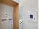 Functional laundry area with appliances hookups and neutral white cabinets at 734 S State St, Raleigh, NC 27601