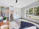 Bright living room with large windows, hardwood floors, and a comfortable seating area at 734 S State St, Raleigh, NC 27601