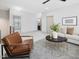 Cozy living area with a chair, sofas, and easy access to the other rooms at 734 S State St, Raleigh, NC 27601