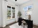Bright office space with large windows, modern desk, and comfortable workspace at 734 S State St, Raleigh, NC 27601