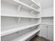 Walk-in pantry provides ample storage with numerous white shelves and cabinets at 734 S State St, Raleigh, NC 27601