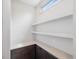 A butler's pantry with white shelves and dark brown cabinets and drawers at 734 S State St, Raleigh, NC 27601