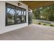 Well-lit outdoor patio features modern design elements, black framed windows, and a view of the surrounding landscape at 734 S State St, Raleigh, NC 27601