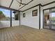 Cozy outdoor porch with shiplap siding, dark trim, and seamless indoor-outdoor flow at 734 S State St, Raleigh, NC 27601