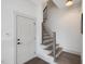Modern staircase with stylish railings, wooden steps, and neutral walls at 734 S State St, Raleigh, NC 27601