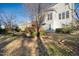 Backyard showing a well maintained lawn and an elevated patio at 7772 Silver View Ln, Raleigh, NC 27613