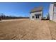 New construction backyard with siding of home and lawn at 8 Steppe Way, Garner, NC 27529