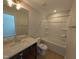 Bathroom with shower, bathtub, vanity, mirror, and wood-look flooring at 8 Steppe Way, Garner, NC 27529