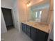 Primary bath with dual sinks, granite countertops, and tiled floors at 8 Steppe Way, Garner, NC 27529