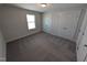 Bedroom with carpet, window, and double closets featuring white doors at 8 Steppe Way, Garner, NC 27529