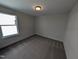 Bedroom featuring carpeted floors, a window for natural light, and fresh paint at 8 Steppe Way, Garner, NC 27529