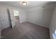 Bedroom with carpet and white trim looking into hallway at 8 Steppe Way, Garner, NC 27529