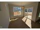 Bright dining area featuring hardwood floors, modern light fixture, large window and sliding door access to the outside at 8 Steppe Way, Garner, NC 27529