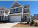 Charming two-story home featuring a 2-car garage and welcoming front yard at 8 Steppe Way, Garner, NC 27529