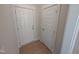 Hallway featuring two doors and wood-look flooring at 8 Steppe Way, Garner, NC 27529