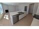 Gourmet kitchen with island sink, stainless steel appliances, and open concept design at 8 Steppe Way, Garner, NC 27529