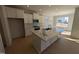 Modern kitchen with quartz countertop island and stainless steel appliances at 8 Steppe Way, Garner, NC 27529