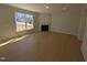 Spacious living room showcasing fireplace and large window at 8 Steppe Way, Garner, NC 27529