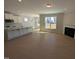 Open concept living room showcasing fireplace, hardwood floors, and lots of light at 8 Steppe Way, Garner, NC 27529