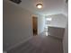 Upstairs loft with carpet, neutral paint, and view to bathroom at 8 Steppe Way, Garner, NC 27529