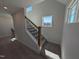 Staircase with carpeted steps and wood railing with iron spindles at 8 Steppe Way, Garner, NC 27529