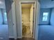 Open view into bathroom with a shower-tub combination at 108 Commons Circle # 228, Clayton, NC 27520