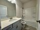 Bathroom with a tub and shower combination at 108 Commons Circle # 228, Clayton, NC 27520
